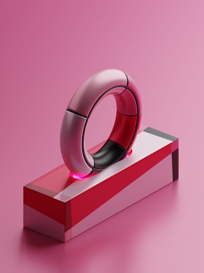 Oura Ring wearable tech product shot on a neutral background, showcasing its design.